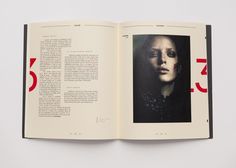 an open book with red numbers on the pages and a photo of a woman's face