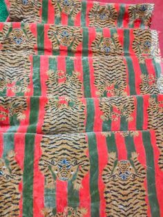 three pieces of cloth with different designs on them