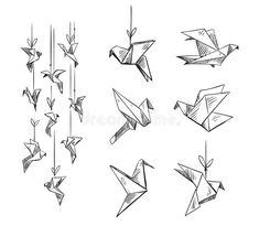 some origami birds hanging from strings