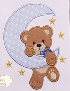 a teddy bear is sitting on the moon