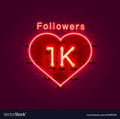 a neon sign that says followers 1k in the shape of a heart on a dark background