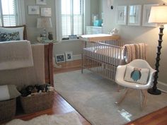 a baby's room is decorated in neutral colors