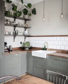 a kitchen filled with lots of counter top space next to a white sink and oven