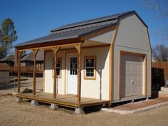 a small building with a porch and attached garage