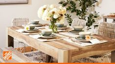 a dining table with plates and cups on it is featured in the home depot ad