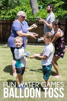 a group of people standing around each other in the grass with text overlay that reads fun water games balloon toss