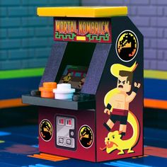 an old school arcade machine with a wrestler on it's front cover and buttons