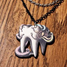 Handmade woodcut tooth and worms necklace

Do not get wet!

#gothicjewelry #spooky #unusual #teeth #weird Halloween Teeth, Tooth Necklace, Accessories Jewelry Necklace, Gothic Jewelry, Women Accessories Jewelry, Spooky Halloween, Women's Jewelry, Women's Accessories, Jewelry Accessories