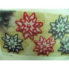 three red and white snowflakes on a beige background