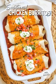 some chicken burritos in a white casserole dish