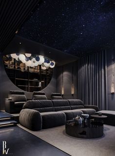 a modern living room with black furniture and stars in the sky above, as well as a circular mirror on the wall