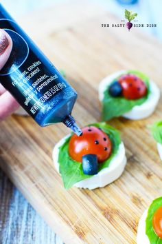 ladybug on top of lettuce with toothpaste being drizzled