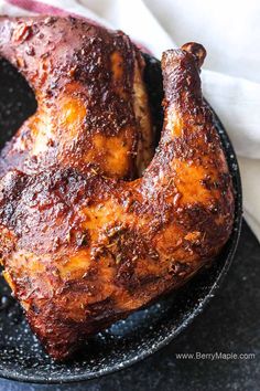 a close up of a chicken on a plate