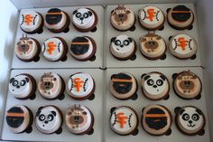 several cupcakes decorated to look like animals and pandas are in the box