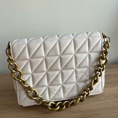 New Without Tag Zara Quilted Bag Made With Faux Leather Material And Has Golden Chain Strap. Condition: Like New Color: Ivory Material: Faux Leather Chic White Pouch Satchel, White Satchel Clutch With Detachable Strap, White Rectangular Shoulder Bag With Gold-tone Hardware, White Square Clutch For Daily Use, Zara Rectangular Bags With Gold-tone Hardware, Trendy Cream Bag With Gold-tone Hardware, Zara Rectangular Shoulder Bag With Gold-tone Hardware, Trendy Cream Bags With Gold-tone Hardware, White Square Shoulder Bag With Gold-tone Hardware