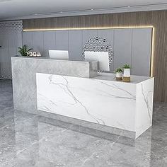 a white marble reception desk in an office