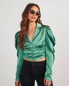 The Stelio Satin Top is a thing of beauty! This long sleeve top features a collared neckline, puff long sleeves and a cropped fit. Front button closures and paneling create a corset-like effect that looks so elevated with high-waisted bottoms. ● True to Size ● Cropped ● Collared Lapel Neckline ● Button Front Closures ● Puff Long Sleeves ● Corset-like Paneling ● Satin Fabric ● Lined ● Self: 100% Polyester, Lining: 100% Rayon ● Dry Clean Only Green Satin Top With Jeans, Vici Collection, A Thing Of Beauty, Puff Long Sleeves, Satin Top, Relaxed Style, Trending Now, A Thing, Satin Fabric