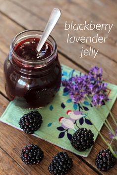 blackberry lavender jelly in a jar with fresh blackberries