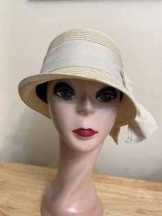 This soft Toyo Straw vintage-inspired natural beige cloche hat is lightweight and the hat will fit up to 22 5/8 inch head size which an inside sizing cord to adjust to your head size. The brim is 2 inches wide. The crown is about 4 1/2 inches tall. The bow band is made from cotton and linen blend material. NOTE: Please check the head size before purchase, I am happy to answer any questions you may have. There will be a 20% restocking fee for all returned hats. Luxury Beige Cloche Hat For Women, Summer Hat With Short Brim In Cream, Summer Hat With Short Brim In Cream Color, Cream Summer Hat With Short Brim, Beige Straw Hat One Size, Cream Straw Hat With Curved Brim, Cream Brimmed Hat Bands For Kentucky Derby, Beige Cloche Hat For Church, Cream Bucket Straw Hat, One Size