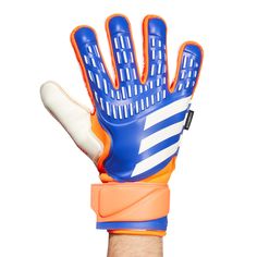 an orange and blue glove is held up in the air