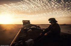 three different pictures with people in the desert and one man sitting on a boat at sunset