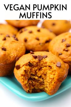 vegan pumpkin muffins on a blue plate with chocolate chips and text overlay