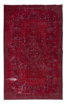 a red rug with an intricate design on the middle and bottom, it is in very dark