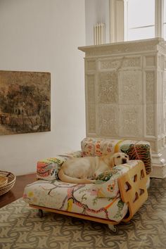 a dog laying on top of a couch in a living room