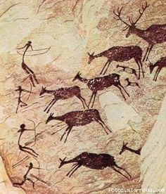 an image of some animals and people in the cave