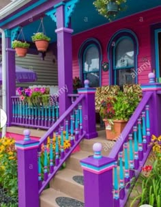 purple and blue house with flower pots on the front porch