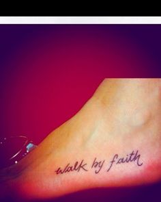 a foot with the words walk by faith written on it and an arrow in black ink