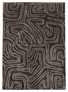 a black and white rug with an abstract design