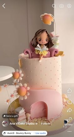 a cake with a doll sitting on top of it and flowers around the edges,