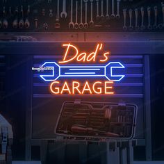 dad's garage neon sign with wrenches and toolbox in the back ground