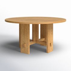 a round wooden table sitting on top of a white floor