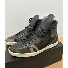 Saint Laurent Camouflage Black Sl10h High Top Sneakers Size Us Mens 12. Eu Size Is 45 In Brand New Unworn Condition. Comes With The Og Box, Fabric Bags, Extra Laces, And A Certificate Of Authenticity Card. Box Has Some Sharpie Marks Done For Inventory Tracking But Not A Big Deal. The Right Shoe Bottom Sole Has Turned A Little Yellow Due To Age/Storage As Shown In Pictures, But Not Noticeable From A Distance When You Wear Them. Open To Offers. Casual Leather Camouflage Sneakers, Casual Camouflage Leather Sneakers, Low-top Camouflage Sneakers With Rubber Sole, Leather Camouflage Sneakers With Round Toe, Camouflage Leather Sneakers With Round Toe, Camouflage Round Toe Sneakers For Streetwear, High-top Sneakers With Leather Sole For Sports, Leather Camouflage Sneakers For Streetwear, Camouflage Leather Sneakers For Streetwear