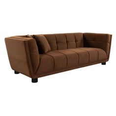 a brown couch sitting on top of a white floor