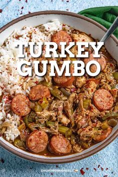 turkey gumbo with green beans and rice in a bowl on a blue tablecloth