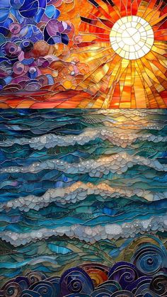 a stained glass window with the sun setting over water and clouds in the sky above it