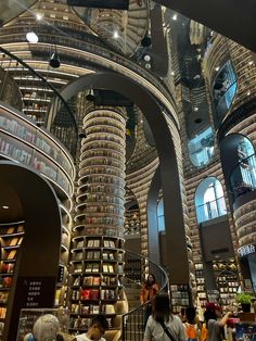 the interior of a large library filled with lots of books