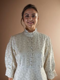 Elevate your wardrobe with this stunning Royale Ivory Cotton Schiffli Tunic, perfect for adding a touch of elegance to any occasion. Crafted from soft, breathable cotton, this tunic features exquisite Schiffli embroidery that adds a delicate and timeless charm. The intricate detailing showcases artisan craftsmanship, making it a unique piece that stands out. Designed with chic cuff sleeves, this tunic offers a versatile and flattering fit, making it ideal for both casual outings and more formal events. Its lightweight and flowy fabric ensures comfort throughout the day, while the subtle ivory shade brings sophistication to any look. Flowy Fabric, Ivory Color, Cuff Sleeves, Dress Clothes For Women, Formal Event, Unique Pieces, Dress Outfits, Cuff, Embroidery