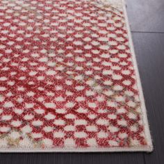 a red and white area rug on the floor