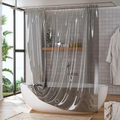 a bathroom with a tub and shower curtain