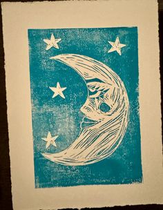 a blue and white drawing of a crescent moon with stars in the sky above it