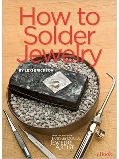 how to solder jewelry book with scissors and other items on the table next to it