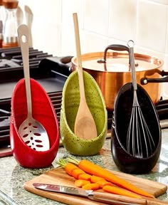 kitchen utensils are lined up on the counter