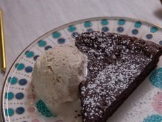 a piece of chocolate cake and ice cream on a plate