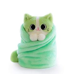 a green cat wrapped up in a blanket with big eyes on it's face