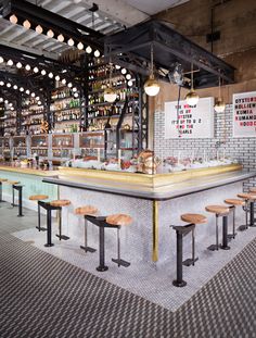 an empty bar with stools in front of it