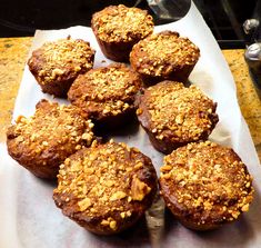 some muffins are sitting on a paper towel